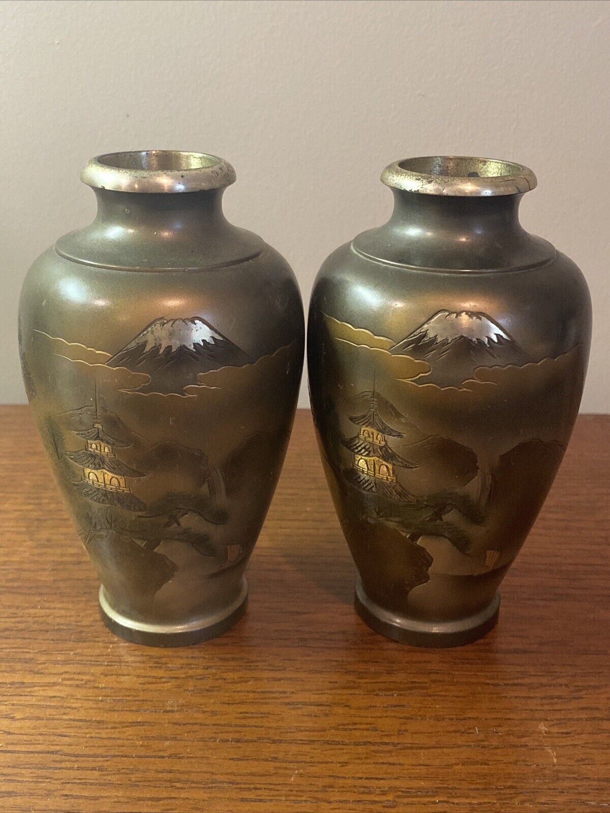 Pair of mixed metal Asian vases. Signed. My Fugi . Pagoda