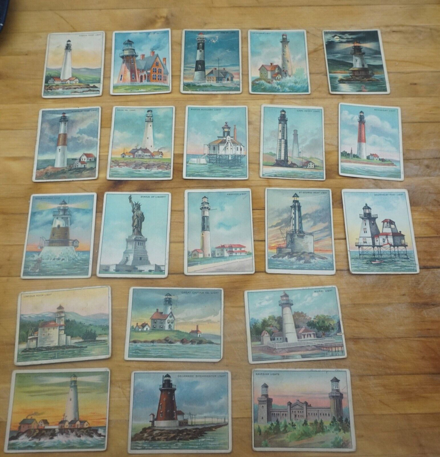 large lot of Hassan Tabacco cards, lighthouse, ships, alaska
