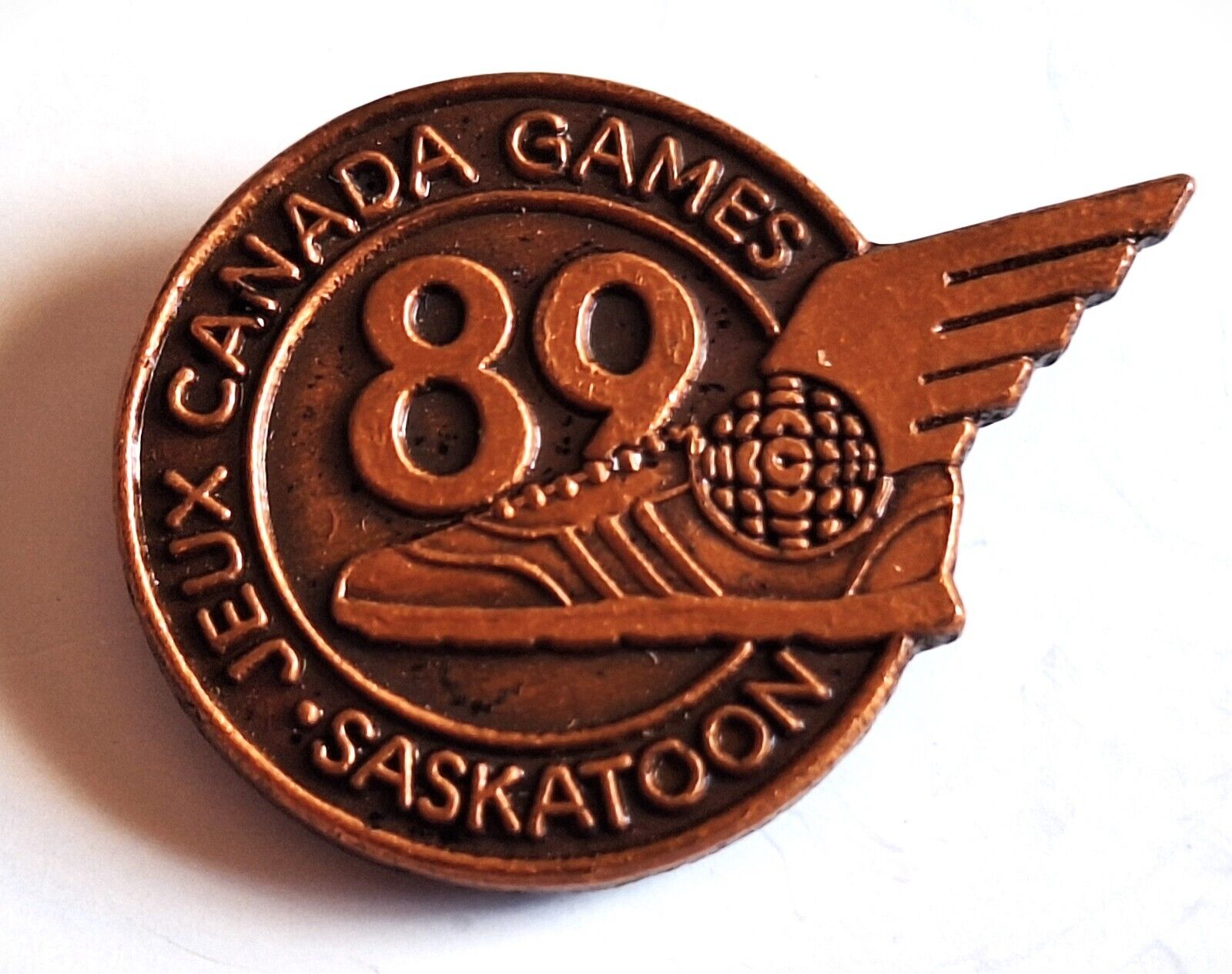 1989 JEUX CANADA Games CBC WINGED SNEAKER TV MEDIA PIN - Saskatoon, Saskatchewan