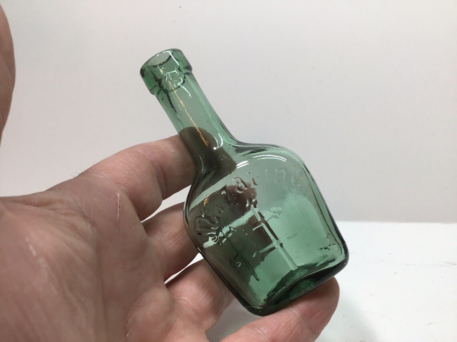 Small Squatty 3 Sided Antique Mazarine Sample Liquor Bottle.