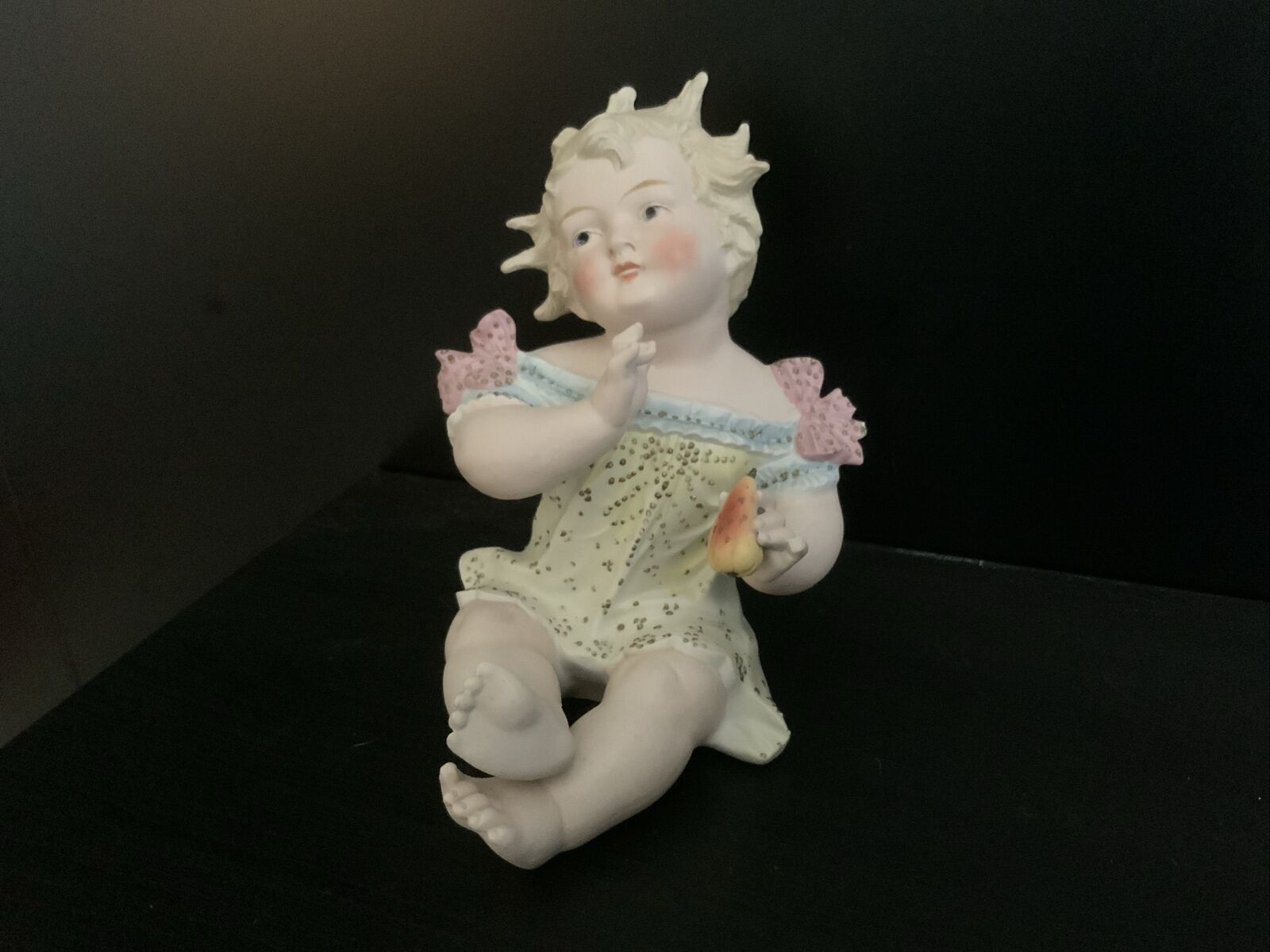 ANTIQUE LARGE PORCELAIN BISQUE PIANO BABY HOLDING PEAR, CONTA BOEHME, 8 INCHES