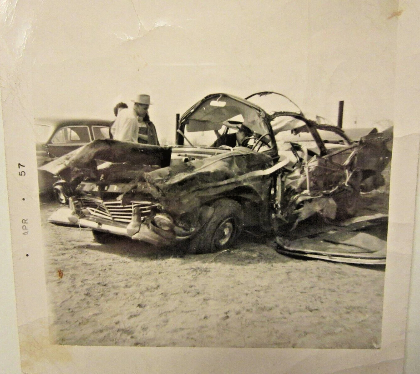 1957 FORD wreck, Apr 9, 1957. George & Carnice Johnson. B&W photo 3 1/2 x 3 1/2.