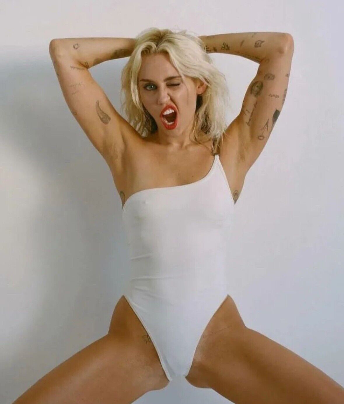 MILEY CYRUS - IN A WHITE ONE PIECE - LEGS OPEN 