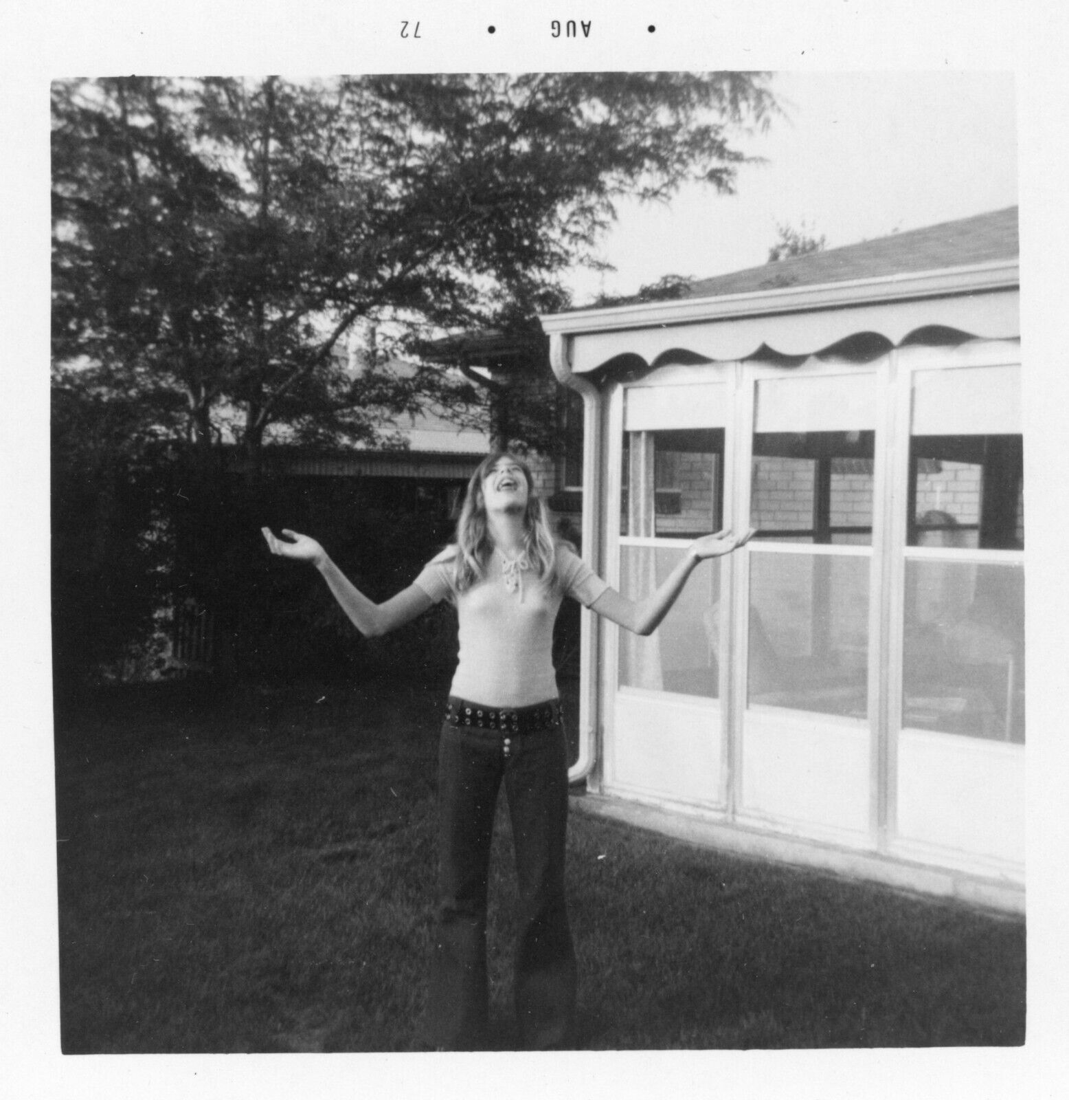 Found Photo 1970s American Teen Girl Long Hair Hip Huggers Funny Pose Vintage