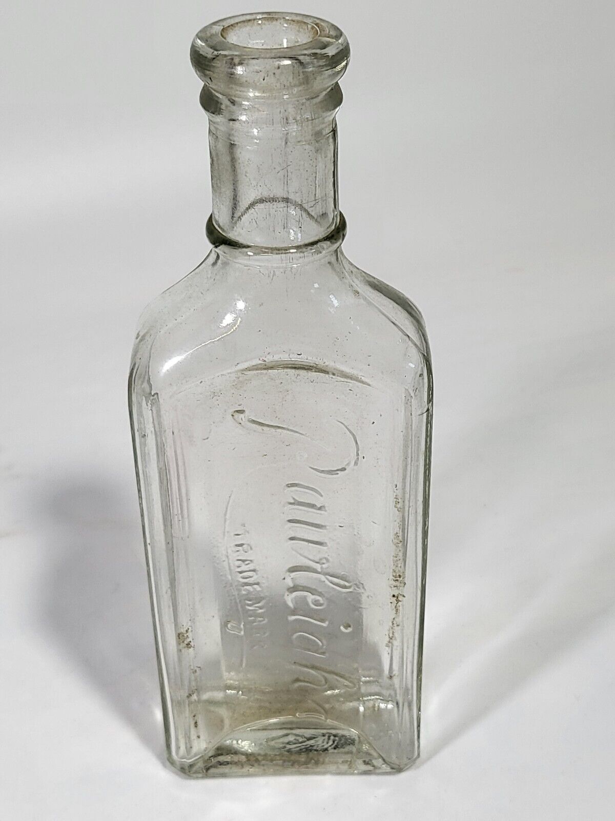 Vintage Raleigh\'s Embossed Medicine Bottle Clear 6.25 Tall