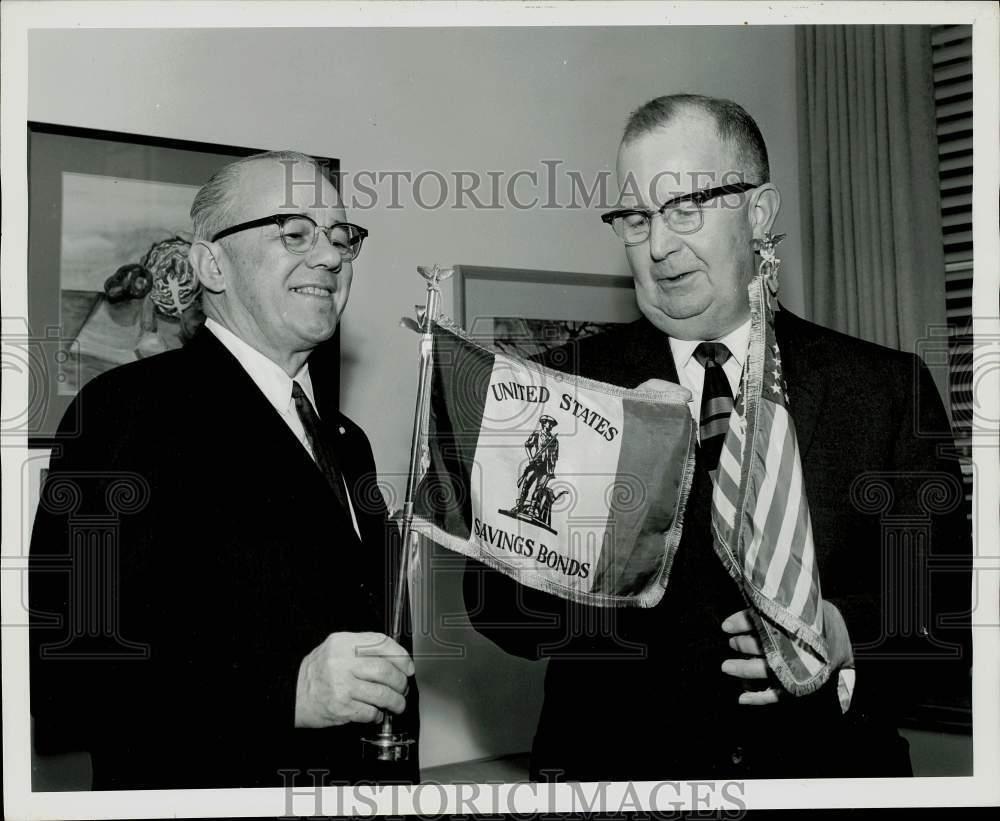 1963 Press Photo Boeing treasurer Evan Nelsen receives flags from William Neal