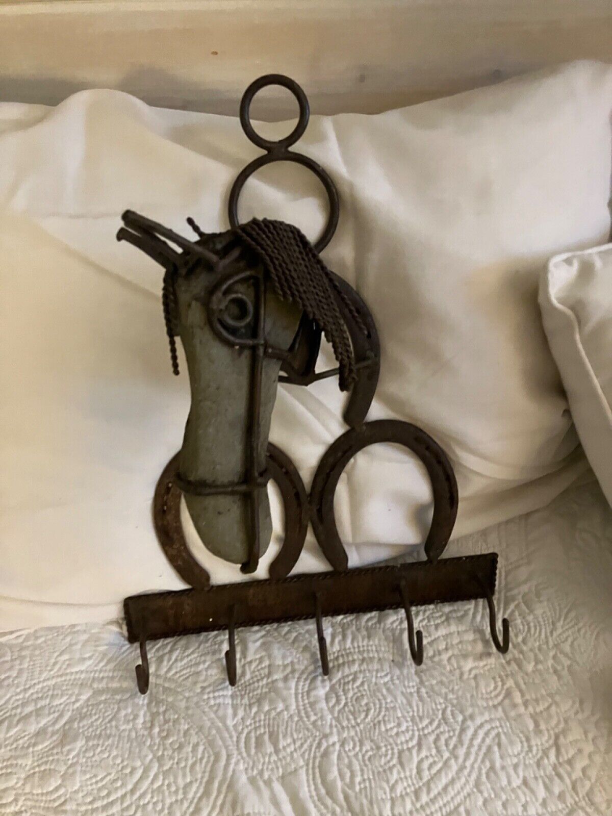 rustic wall hanging  made of stones, rocks, horseshoes, wire— one of a kind—