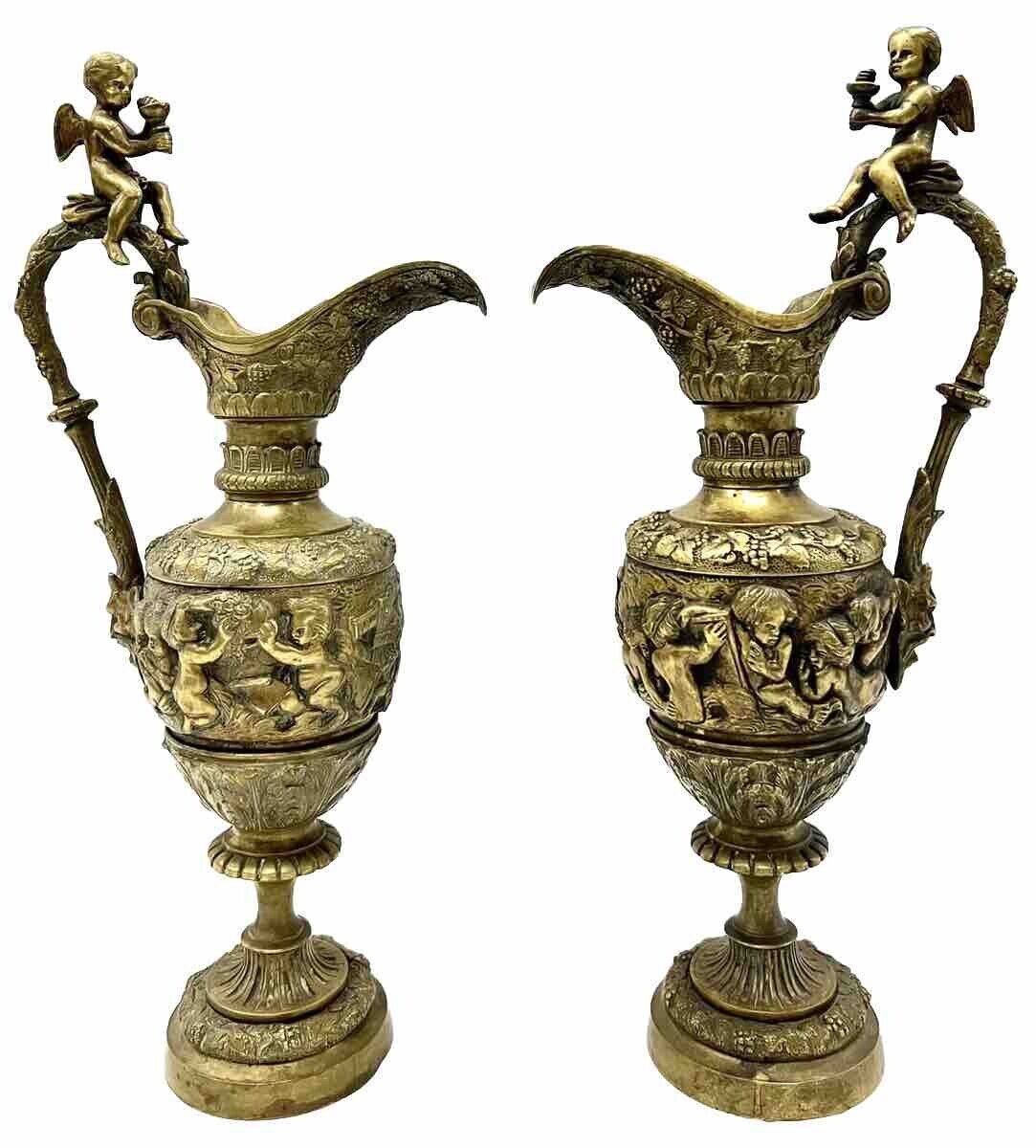 Pair of  impressive antique French figurative patinated/gilded bronze ewers -