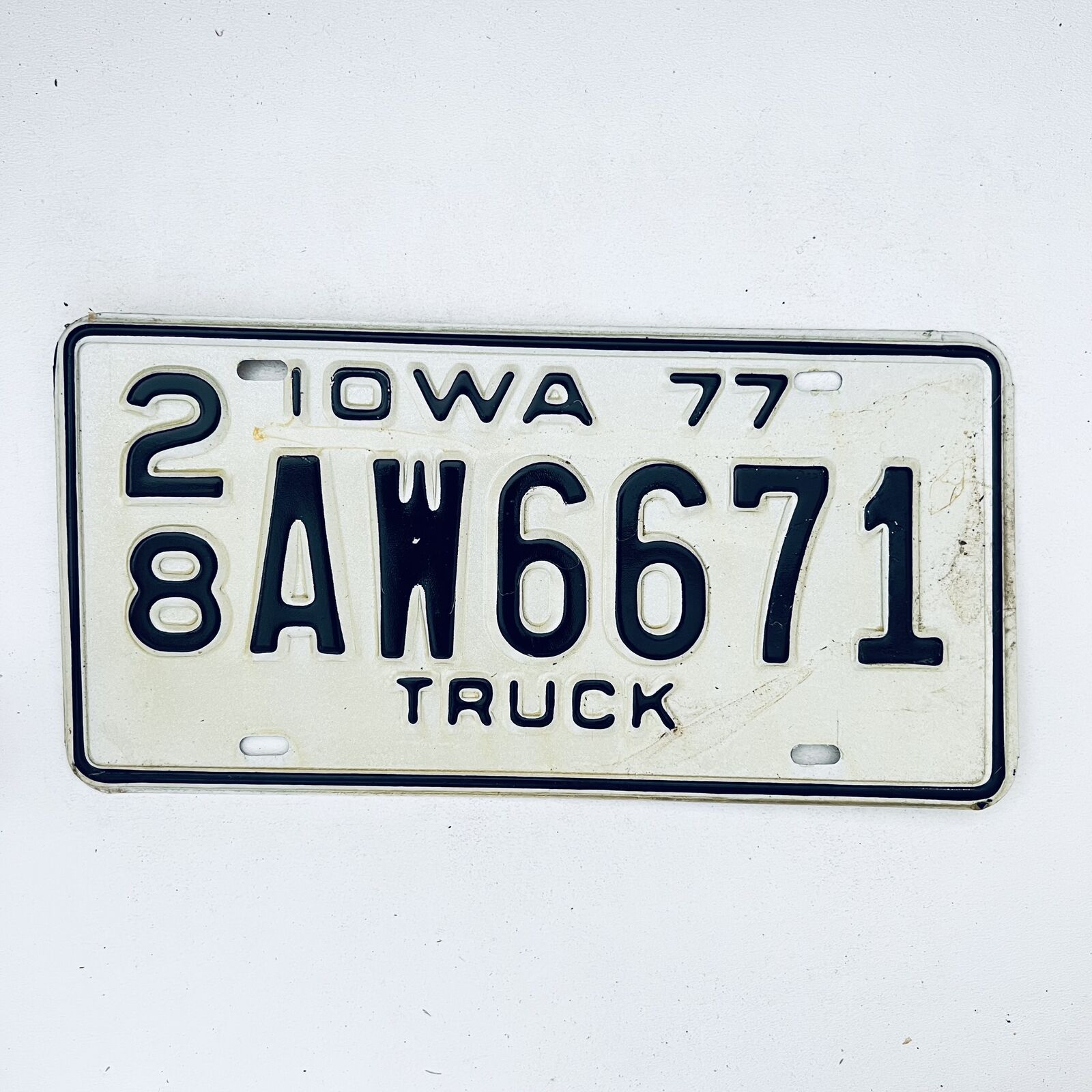 1977 United States Iowa Delaware County Passenger License Plate 28 AW6671
