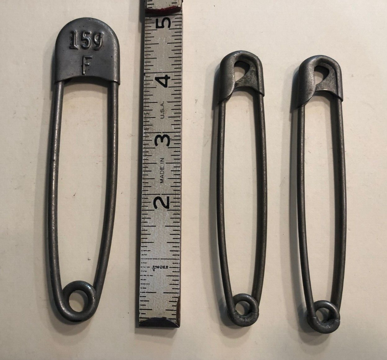 3 vintage large non-magnetic safety/laundry/military pins or key tags 1 numbered