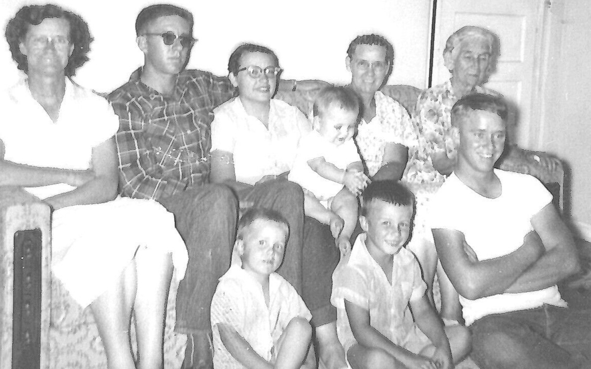 6E Photograph Family Photo Portrait Sitting on Couch Men Women Boys