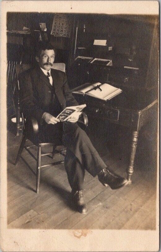 Vintage 1910s Real Photo RPPC Postcard Office Scene - Man at Desk, Reading Book