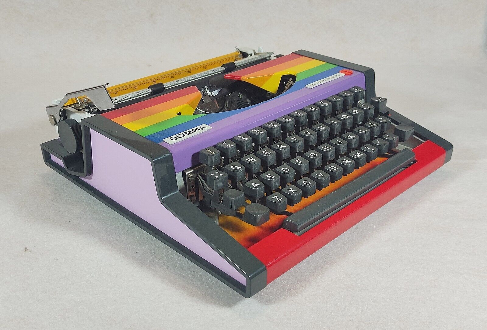 Vintage Olympia typewriter from the 70s – LGBT Rainbow Edition.