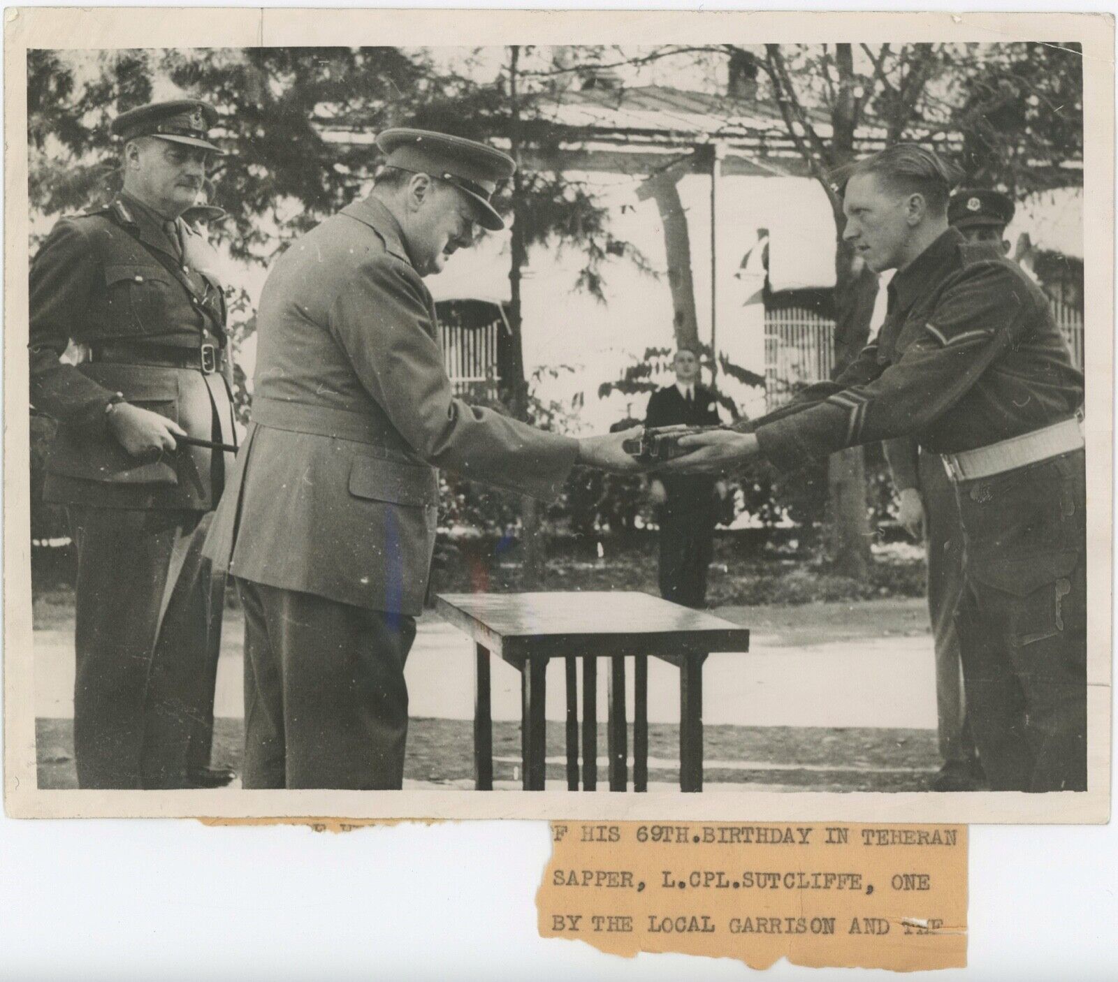 30 November 1943 press photo of Winston Churchill receiving a gift at Teheran