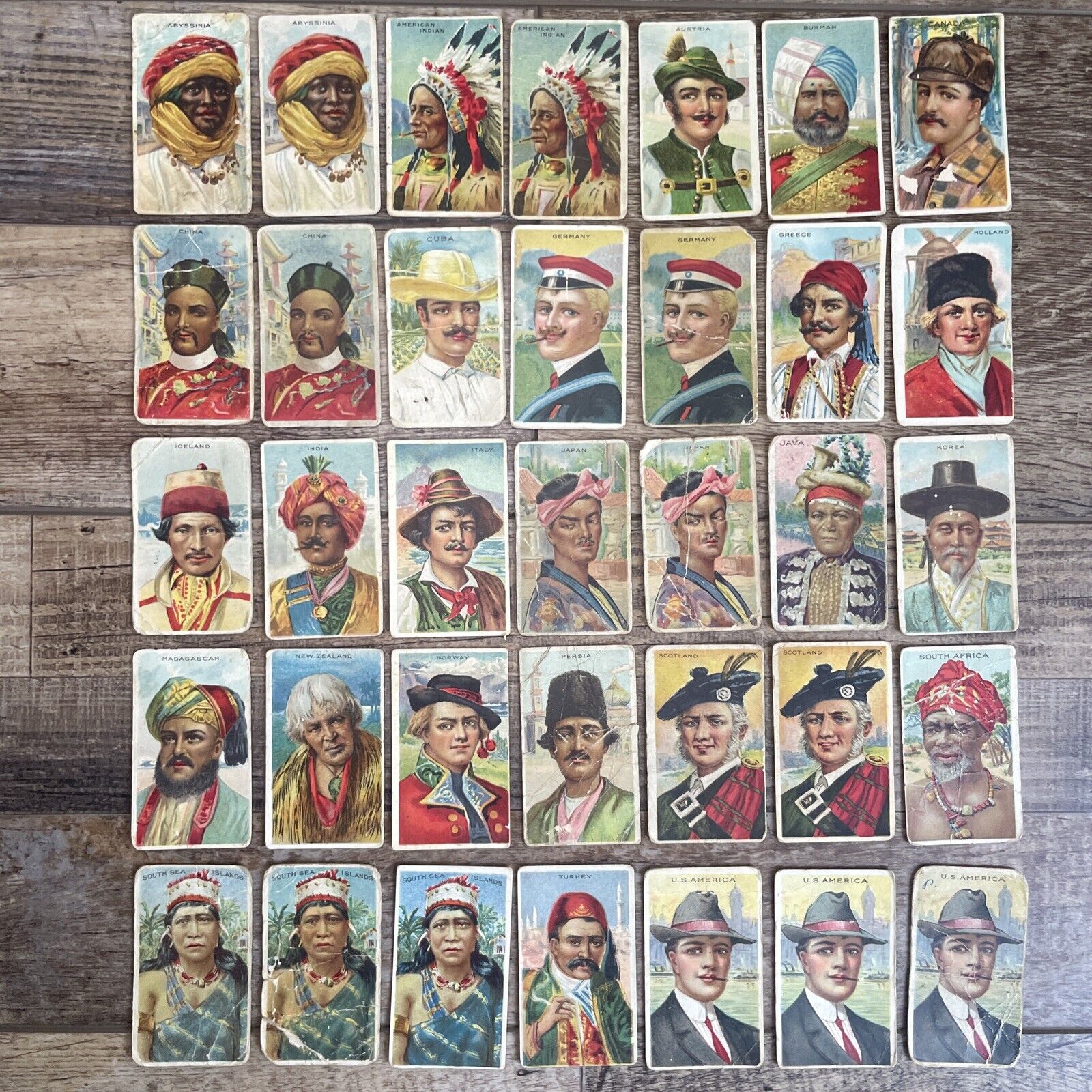 1911 AMERICAN TOBACCO COMPANY TYPES OF NATIONS T113 LOT OF 35 TRADING CARDS