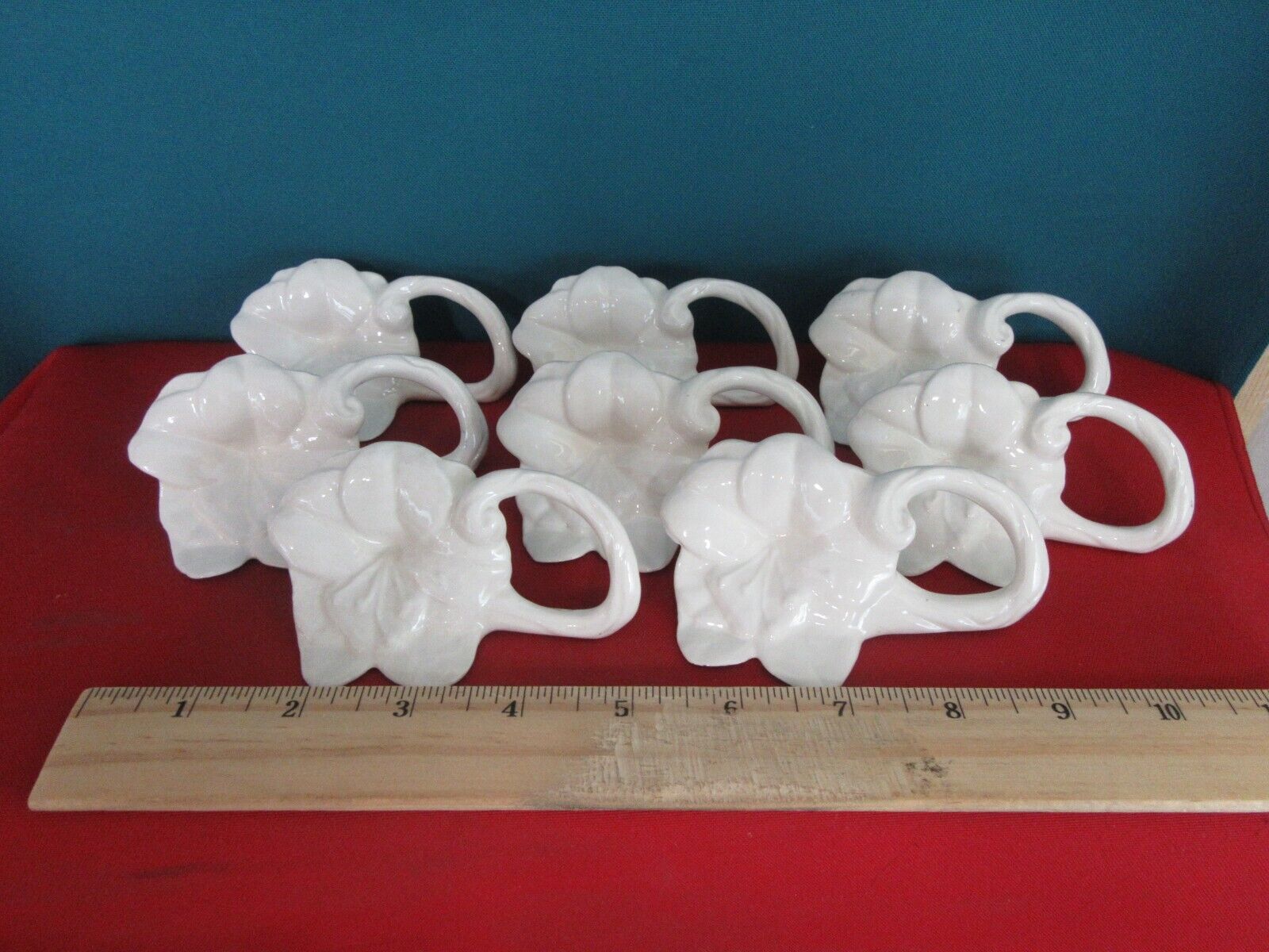 128.  Set of 8 Vintage White Porcelain Ceramic Napkin Rings Flower Shape Floral
