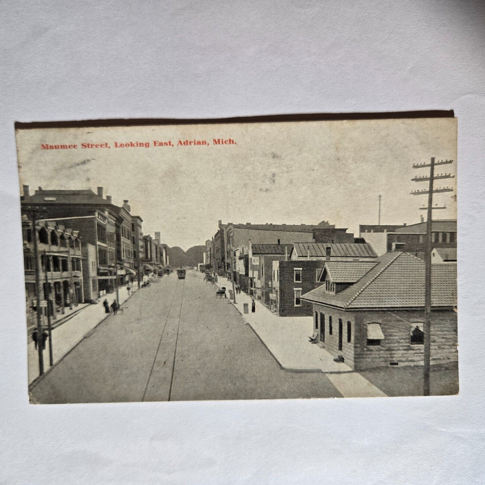 Monroe Street Looking East Adrian MI Postcard 1909 from Adrian w/ flag cancel