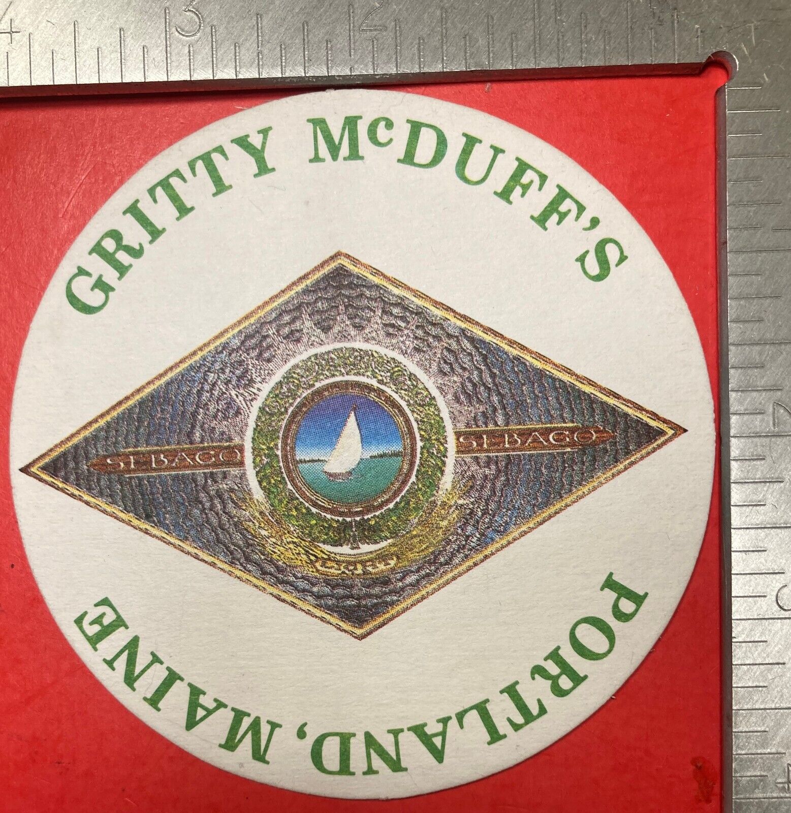 GRITTY McDUFF\'S. PORTLAND,MAINE. 4 INCH ROUND BEER COASTER VINTAGE SAILBOAT