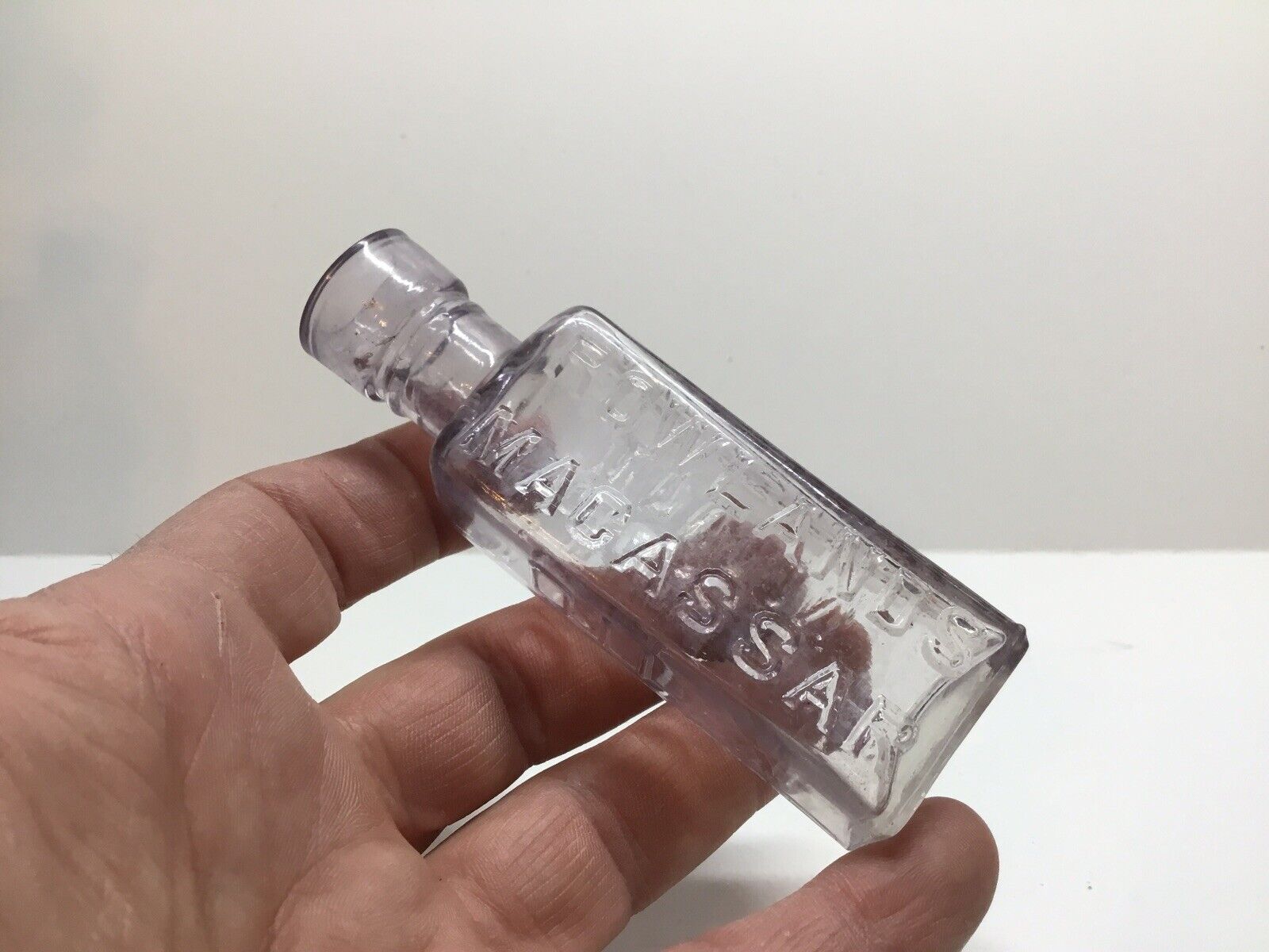 The Original And Genuine Antique Light Amethyst Macassar Oil Bottle.