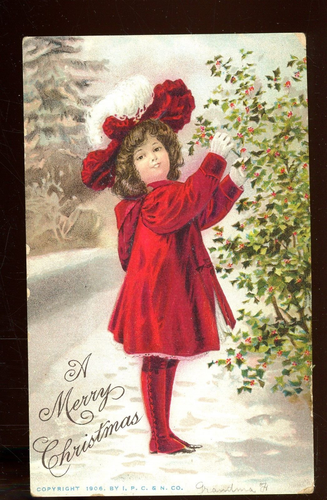 Christmas-child picking holly berries-1908