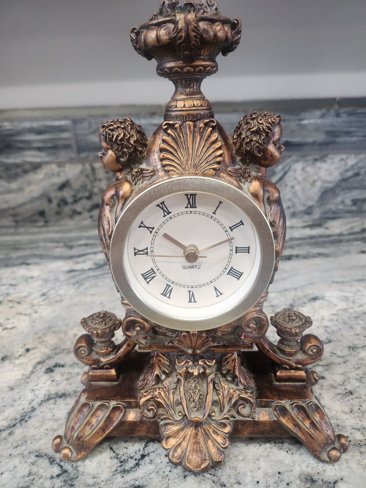 Antique Bronze Double Cherub and Finely Sculpted Quartz Table Shelf Clock 