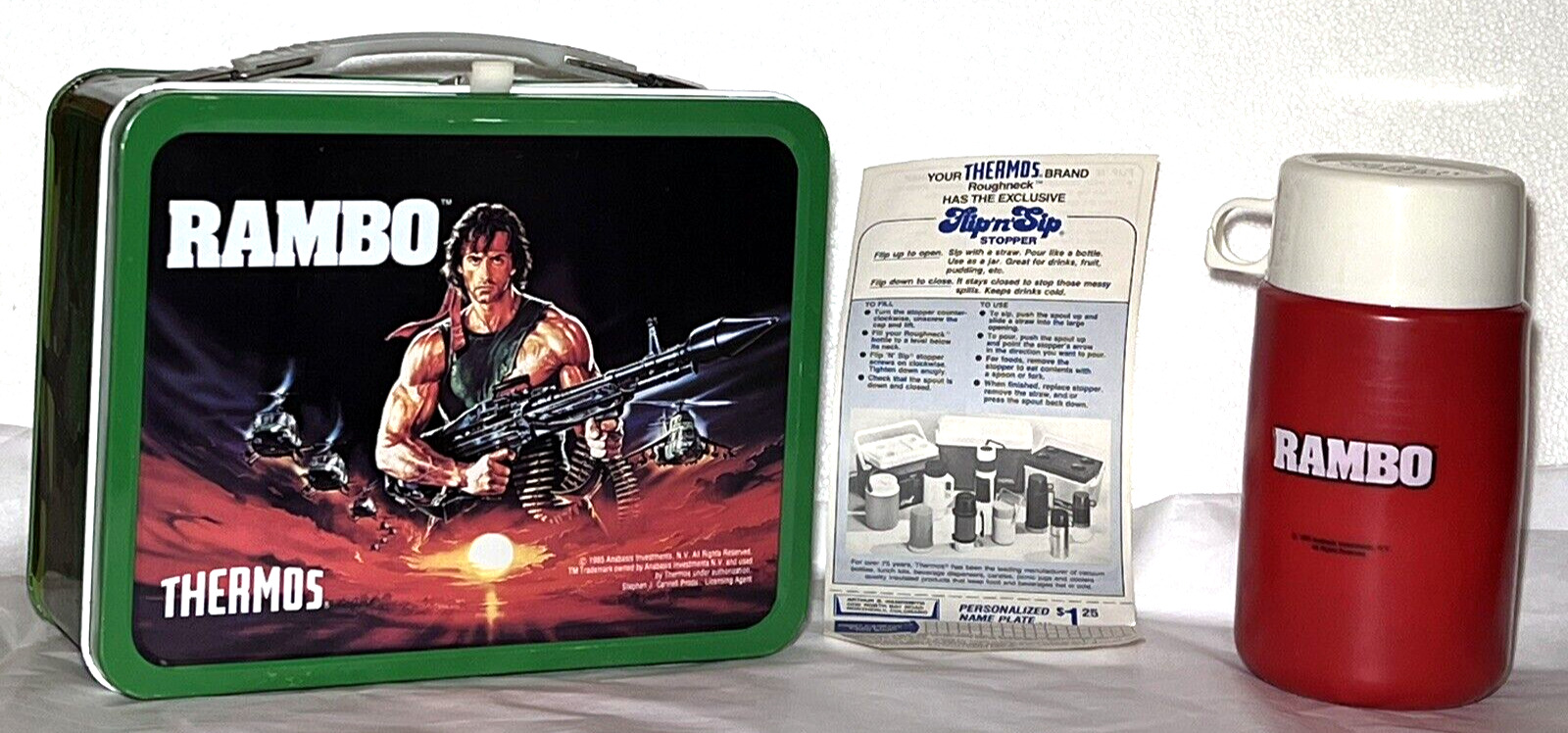 VINTAGE RAMBO 1985 LUNCHBOX AND THERMOS - UNUSED w/ PAPER INSERT
