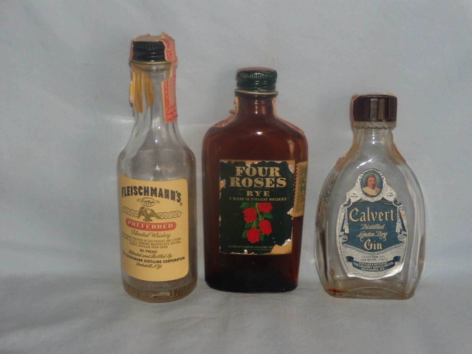 3 Vintage Mini Airplane Liquor Bottles (Calvert, Four Roses, Fleischmann\'s)