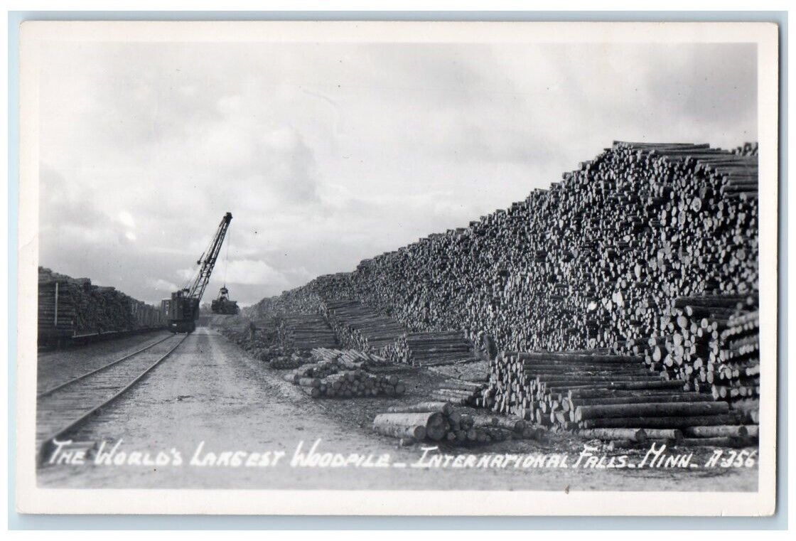 c1920's World's Largest Woodpile International Falls MN RPPC Photo Postcard