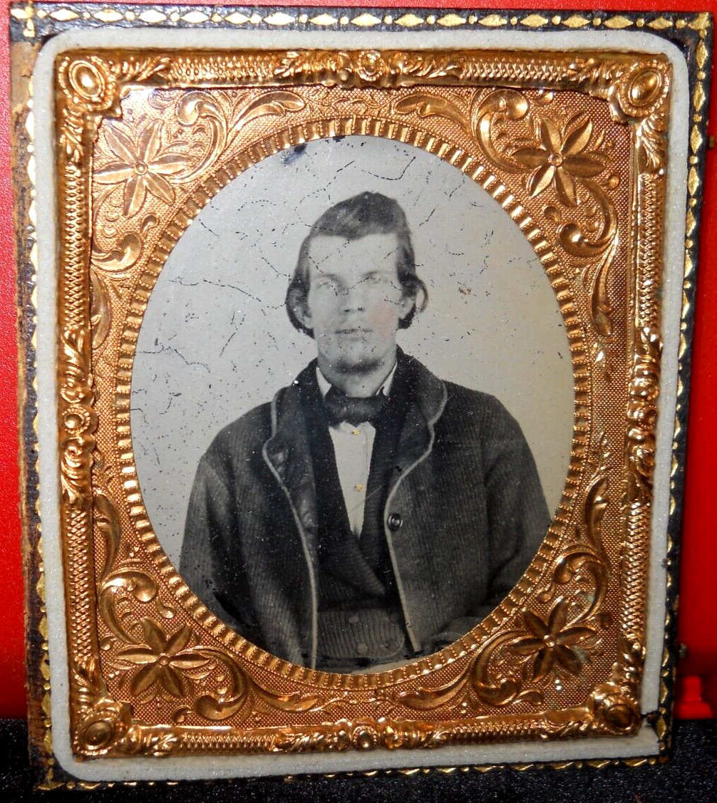 1/6th Size Ambrotype of young man in half case