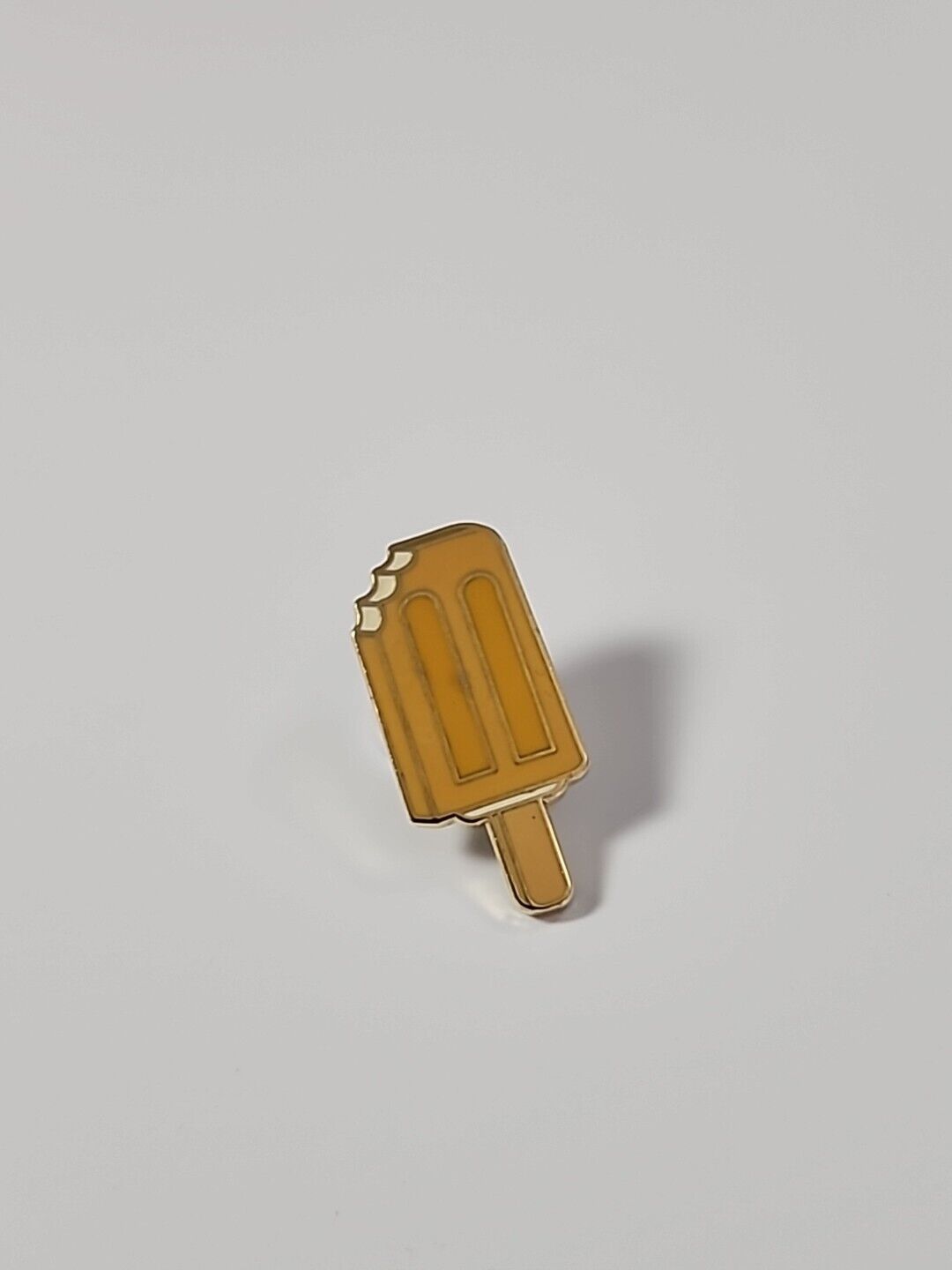 Light Orange Popsicle Lapel Pin With Bites 
