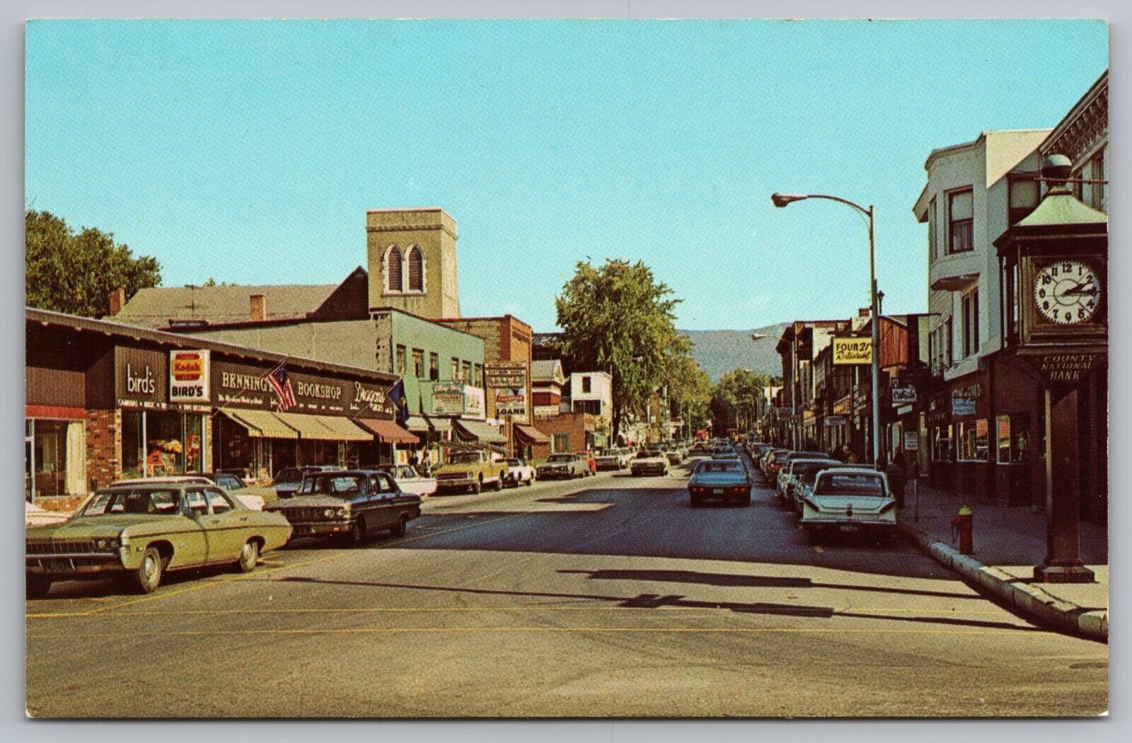 Postcard Main Street Bennington Vermont 1970 Chevy Impala Kodak Sign Classic Car