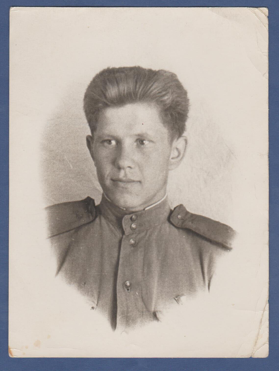 Portrait of a Soviet soldier in uniform, handsome guy. Soviet Vintage Photo USSR