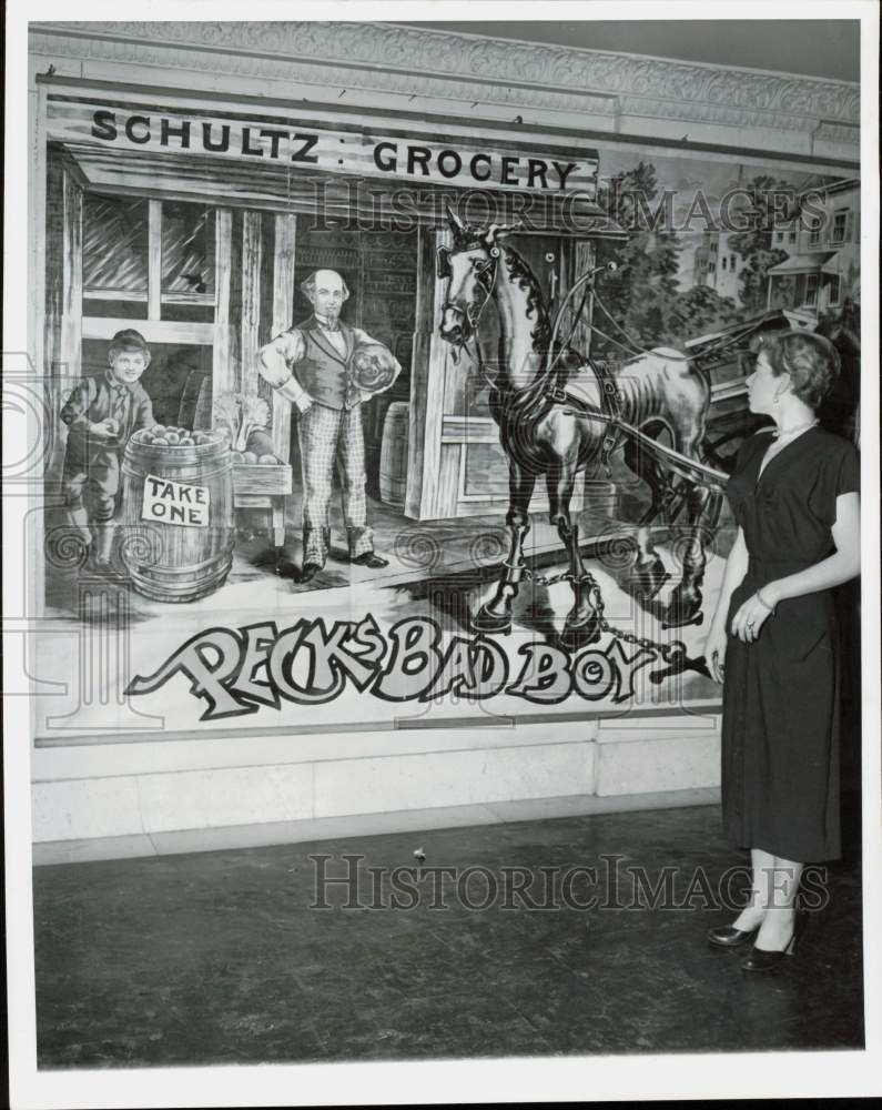 1951 Press Photo Colleen Kennedy looks at old theater backdrop in Chicago