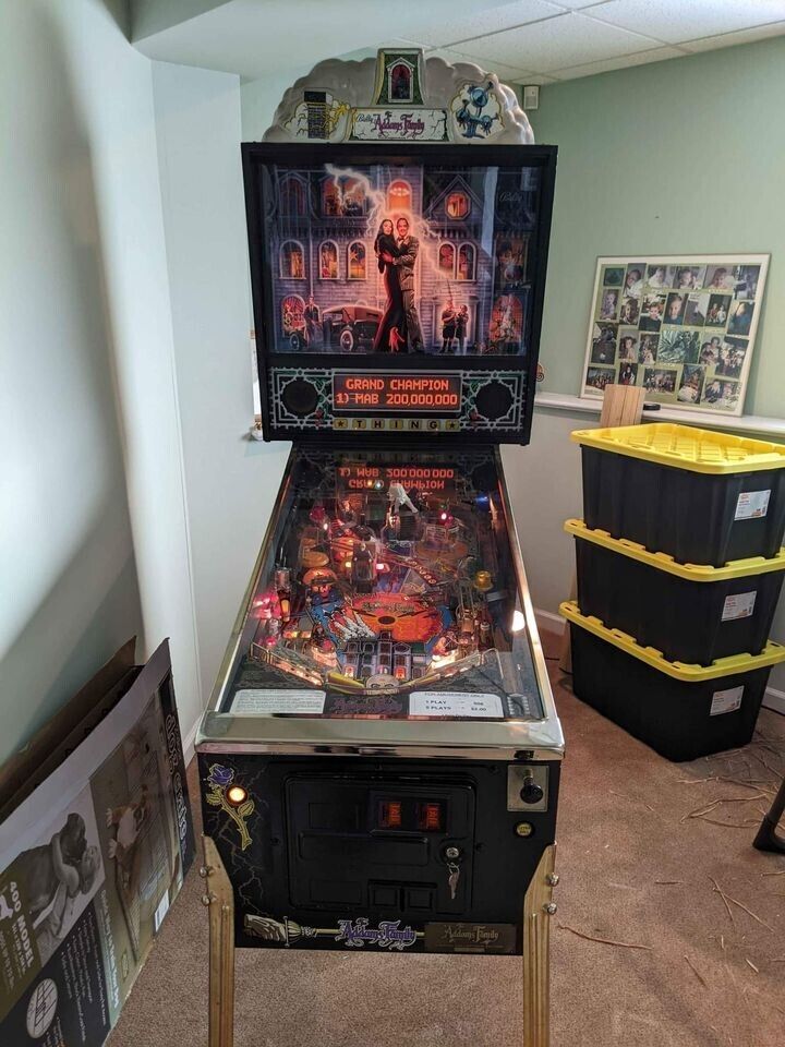 Addams Family Gold Collectors pinball machine with gold collectors certificate.