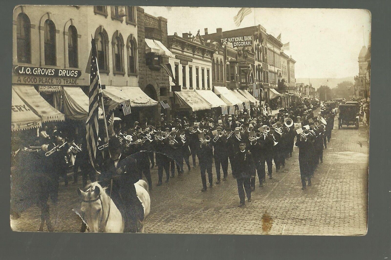 Decorah IOWA RPPC 1911 LUTHER COLLEGE Band HOME FROM NORWAY Parade MAIN STREET