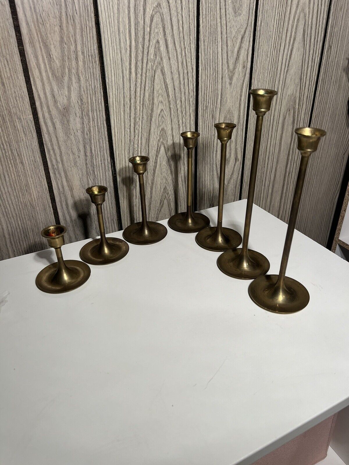 Vintage 7 piece brass candle sitck set