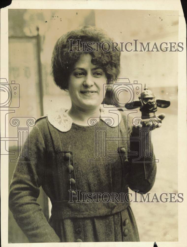 1919 Press Photo Woman Holding Pig Figurine with German Helmet, Versailles