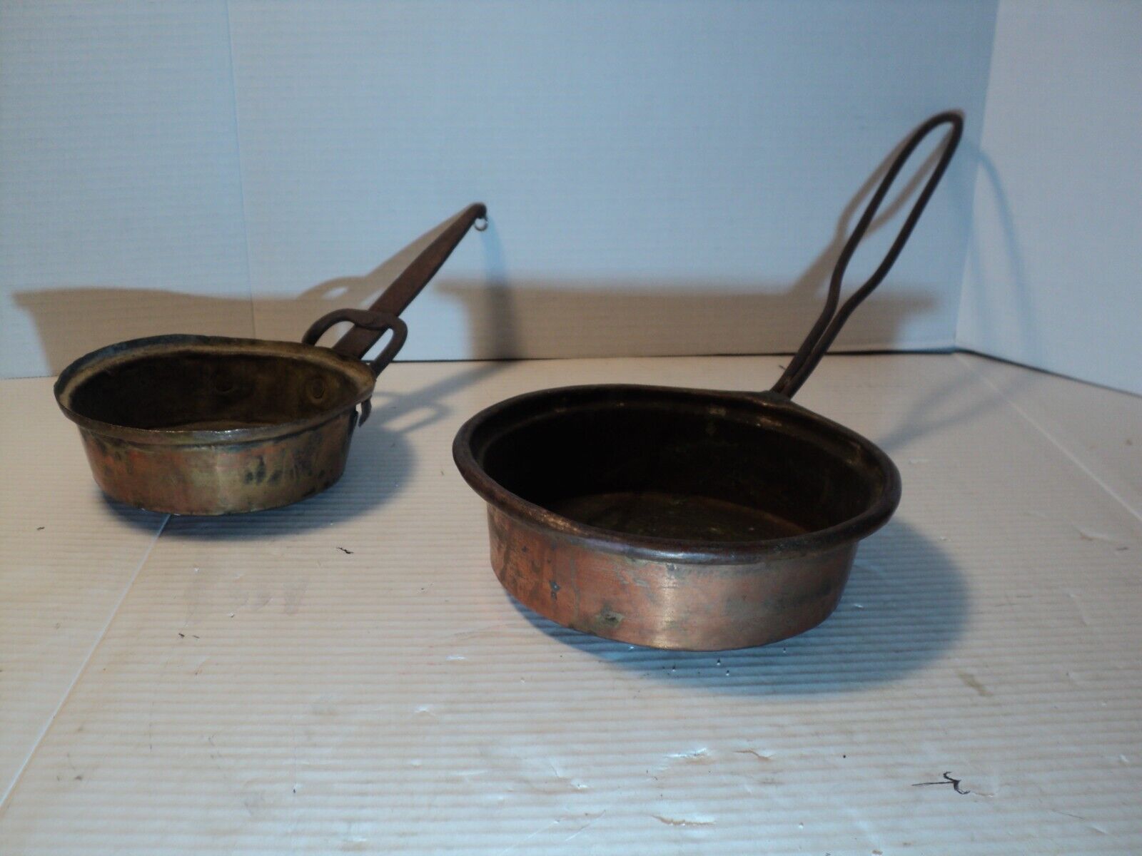 2 antique copper cooking pans hand made with hand forged iron handles