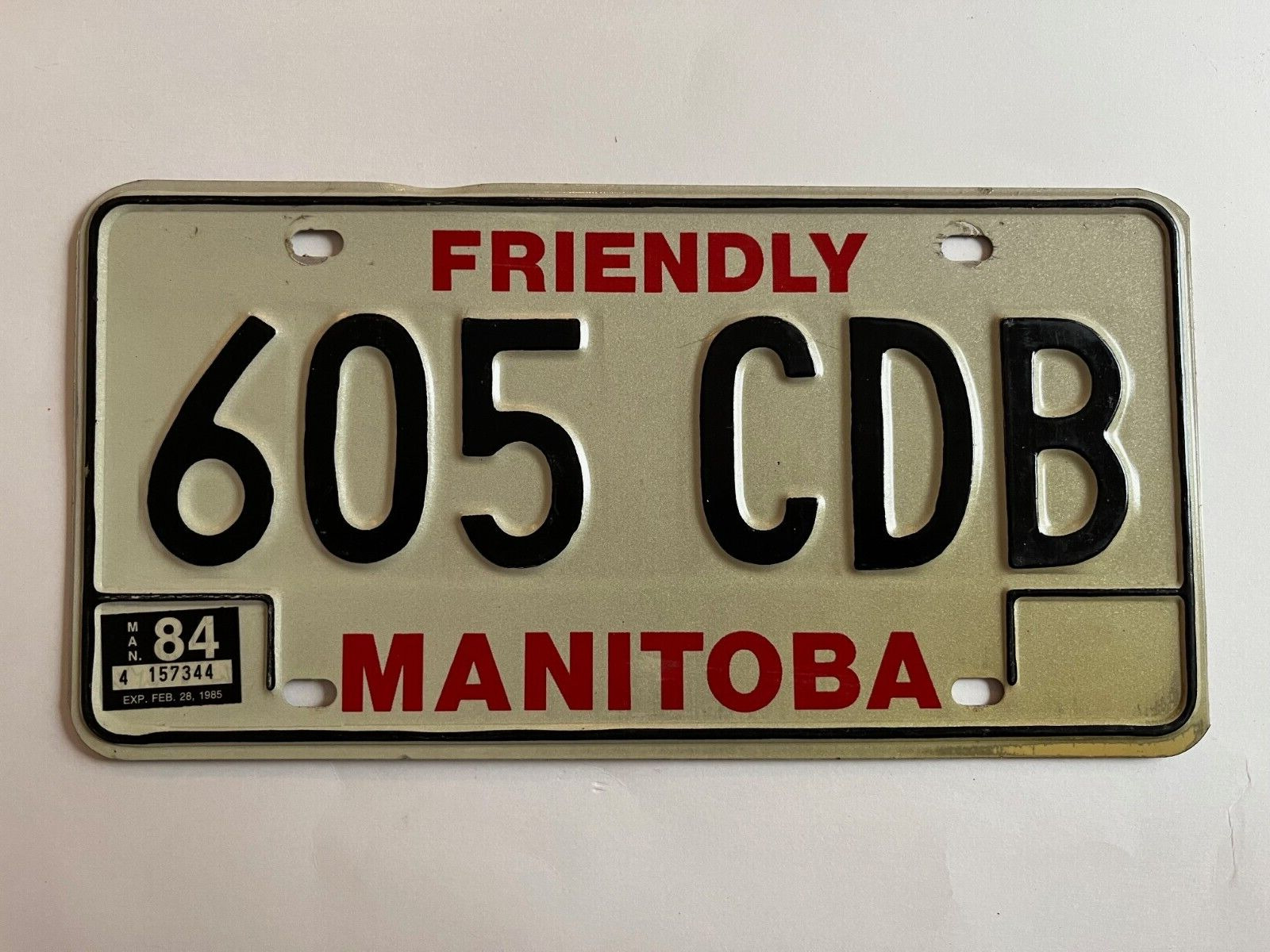 1984 Manitoba License Plate Natural Sticker, Expires 1985 VERY GOOD 40 Years Old