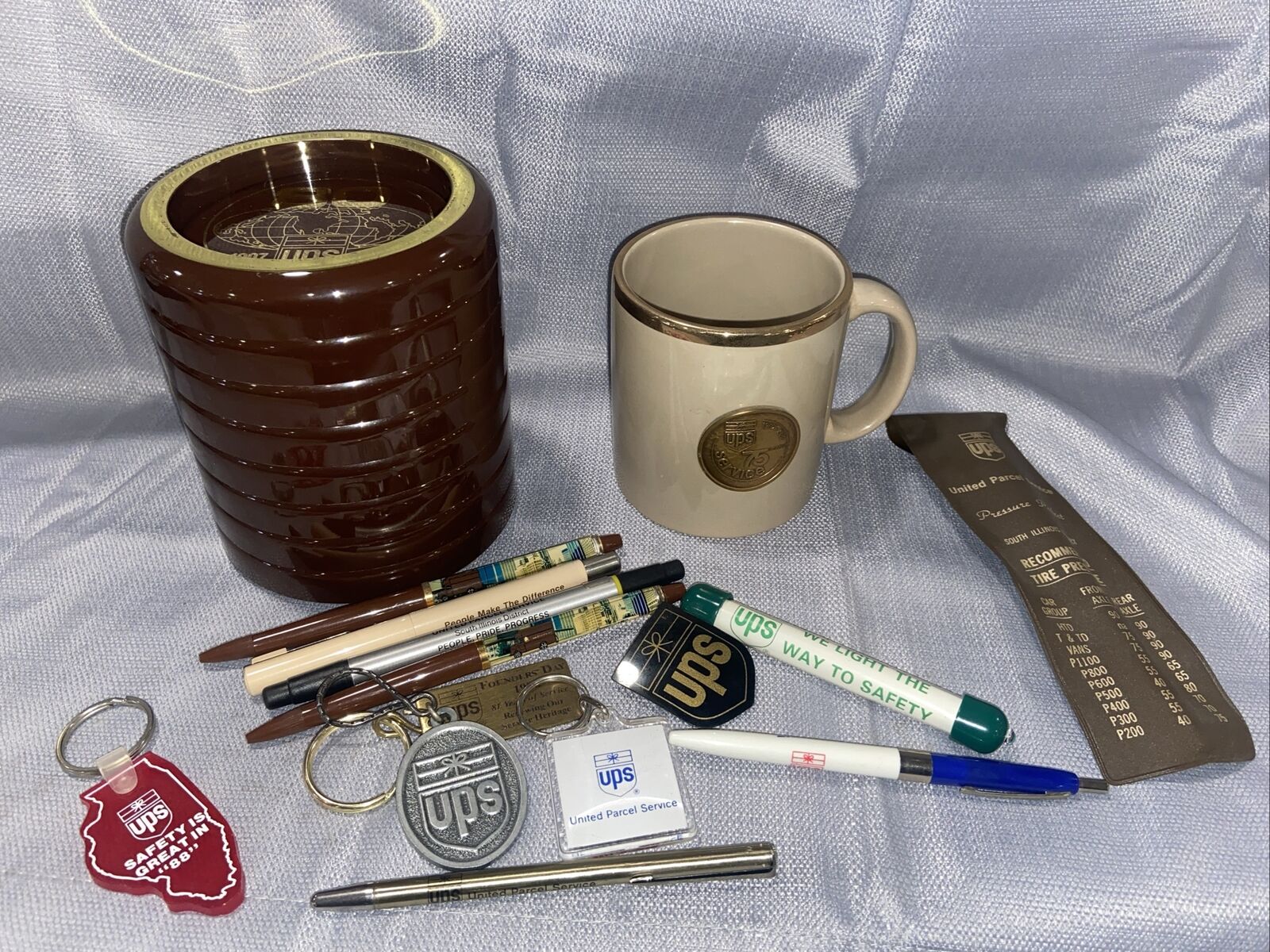 UPS Collectible lot- 8- UPS DRINK COASTERS SET  BROWN 1907-1987, Pens, Mug,&more