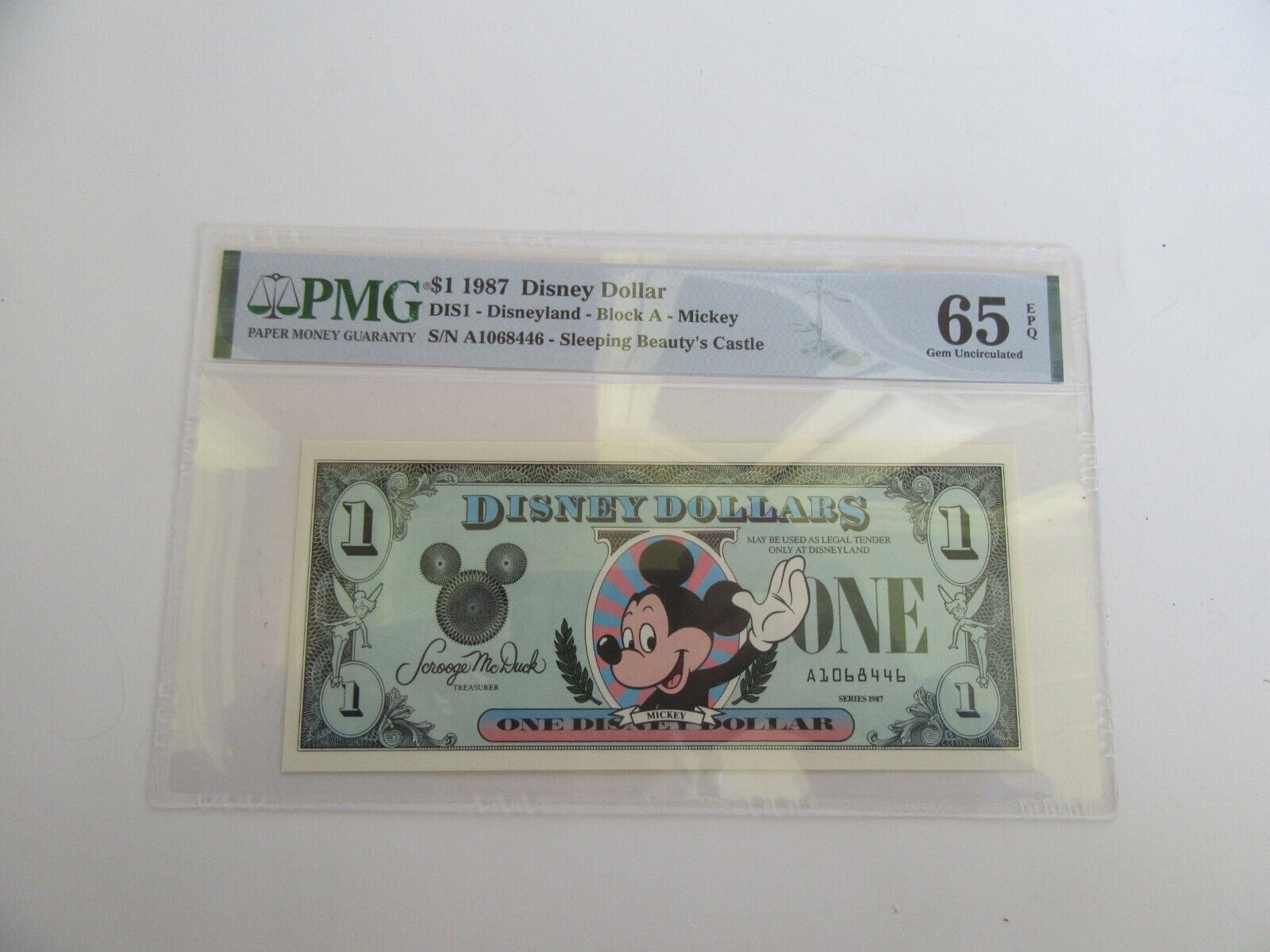 1987 Disney $1 Dollar Disneyland Sleeping Beauty\'s Castle, Block A, PMG 65