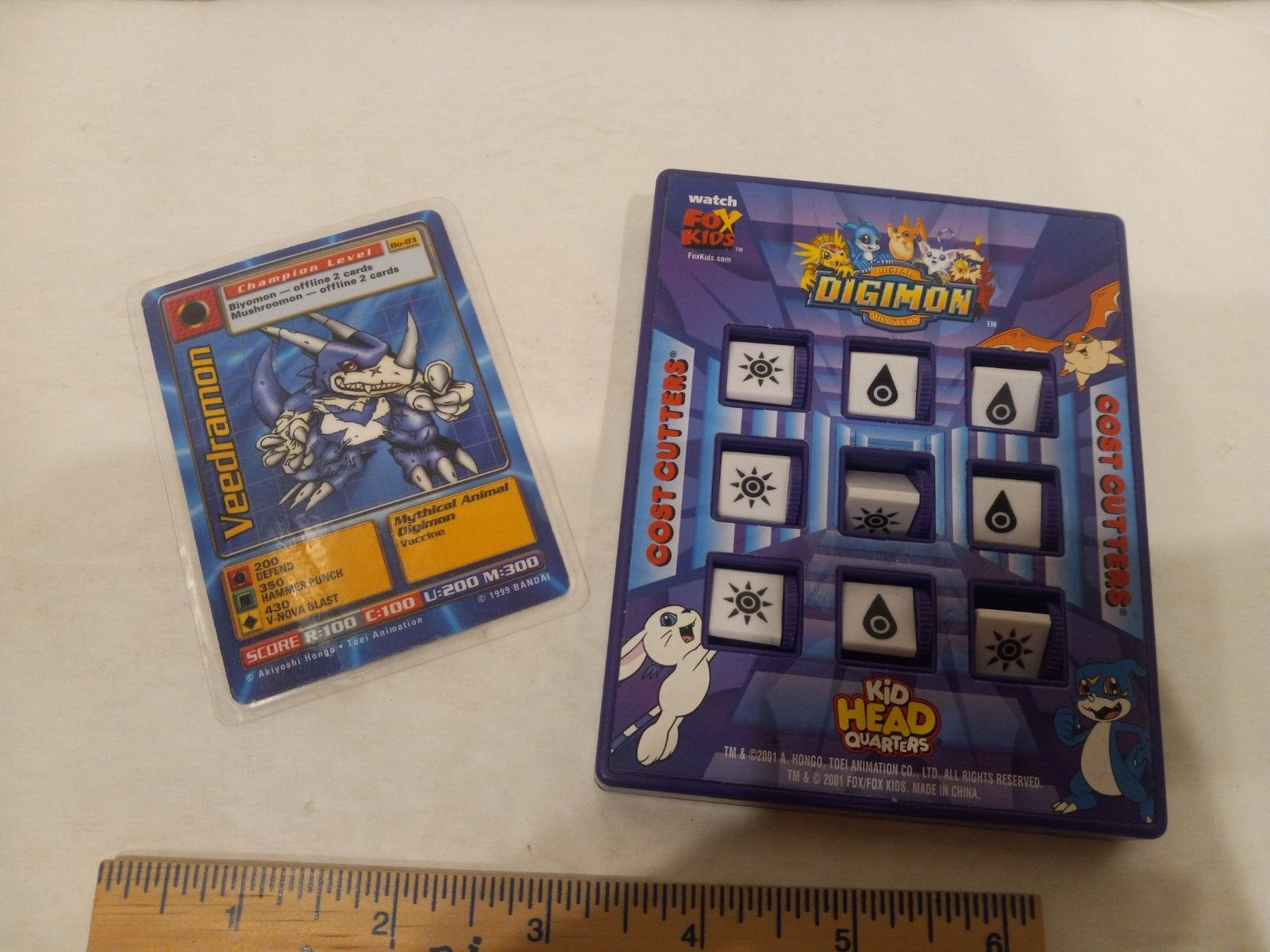 DIGIMON 2001 Toy Game and laminated card dated 1999 Bandai