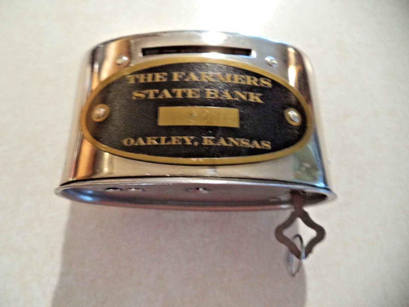Handle Coin Savings Bank # 67 The Farmers State Bank Oakley, Kansas  with 1 Key