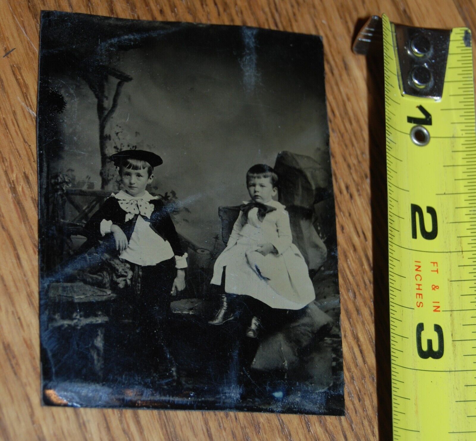 Tintype of 2 little boys with huge bow ties