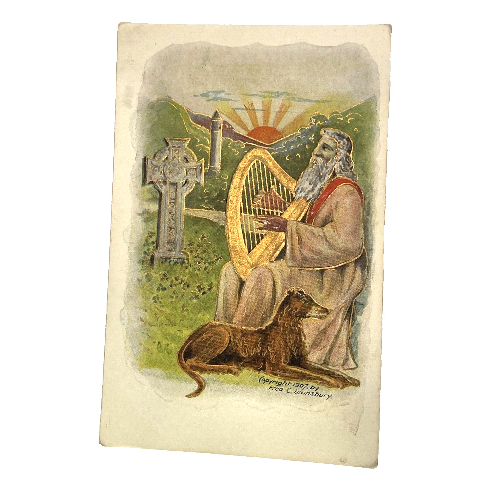 Antique 1907 Embossed Fred C Lounsbury Man Plays Harp Dog Cross Gilt Postcard