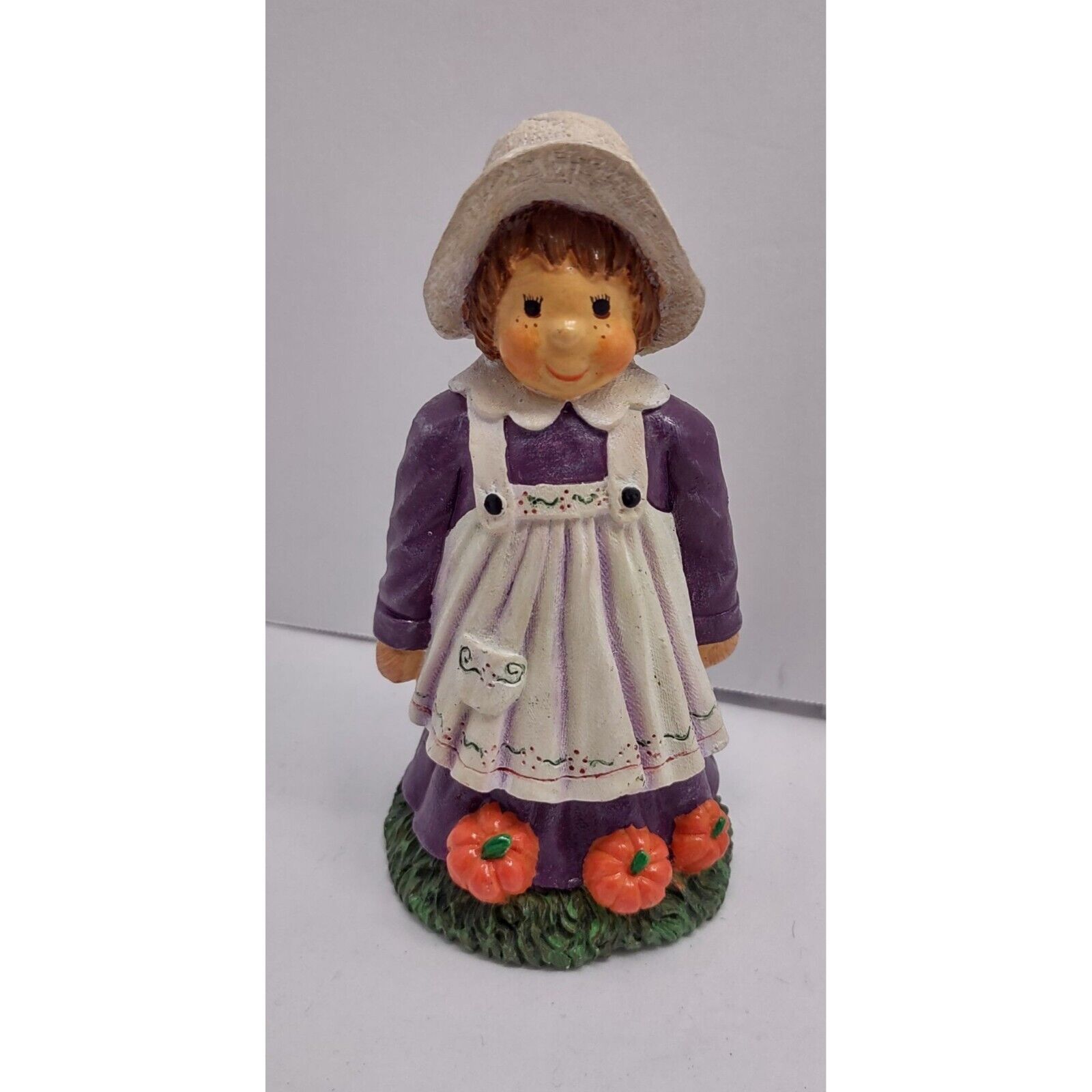 Vintage pilgrim girl with pumpkins ceramic figurine