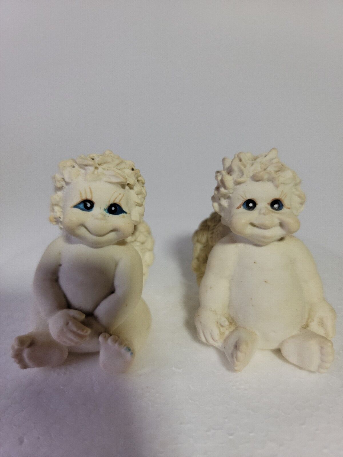 Dreamsicles Blue Eyed Angel Cherub Figurines off white color