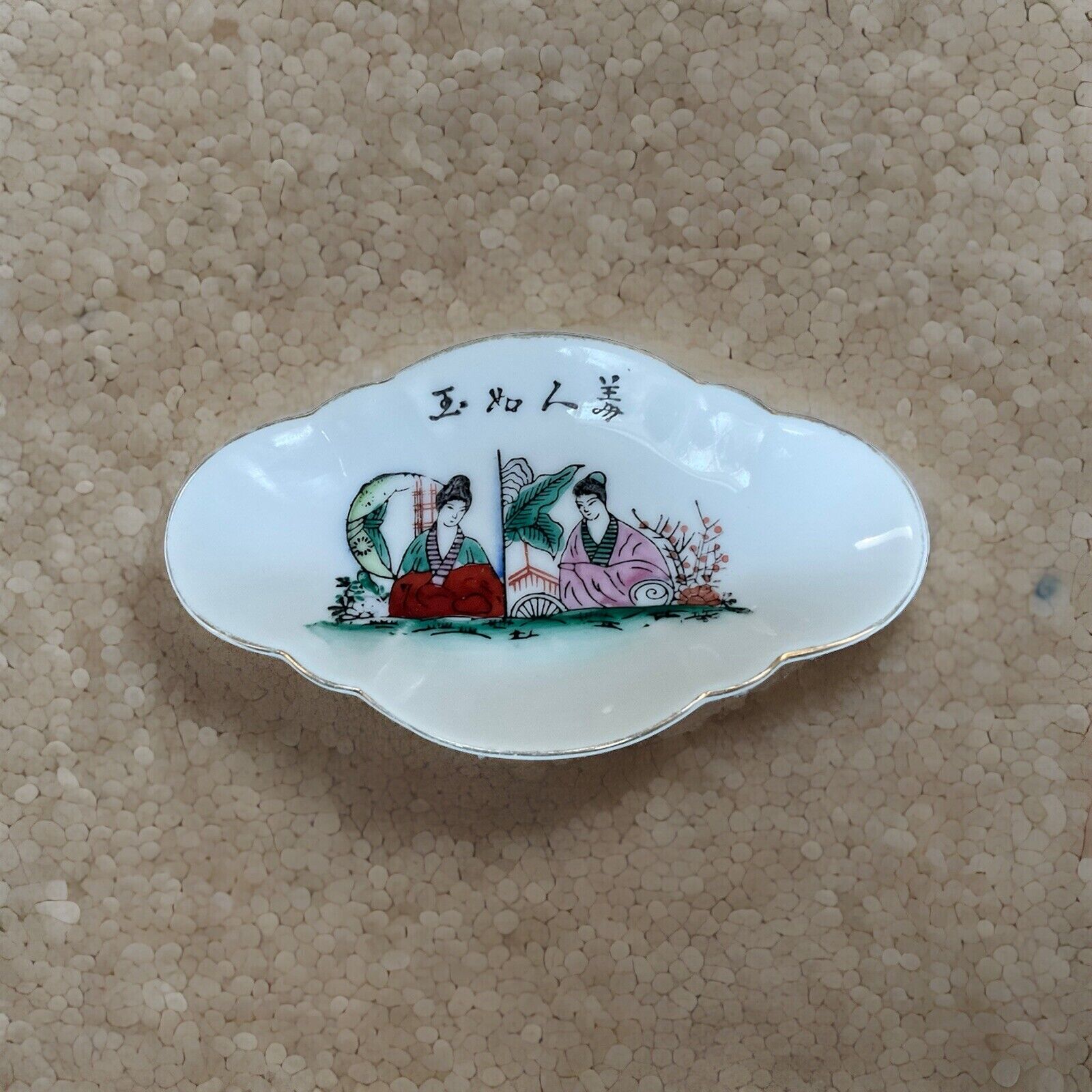 Colorful hand-painted porcelain plates depicting ancient Chinese beauties