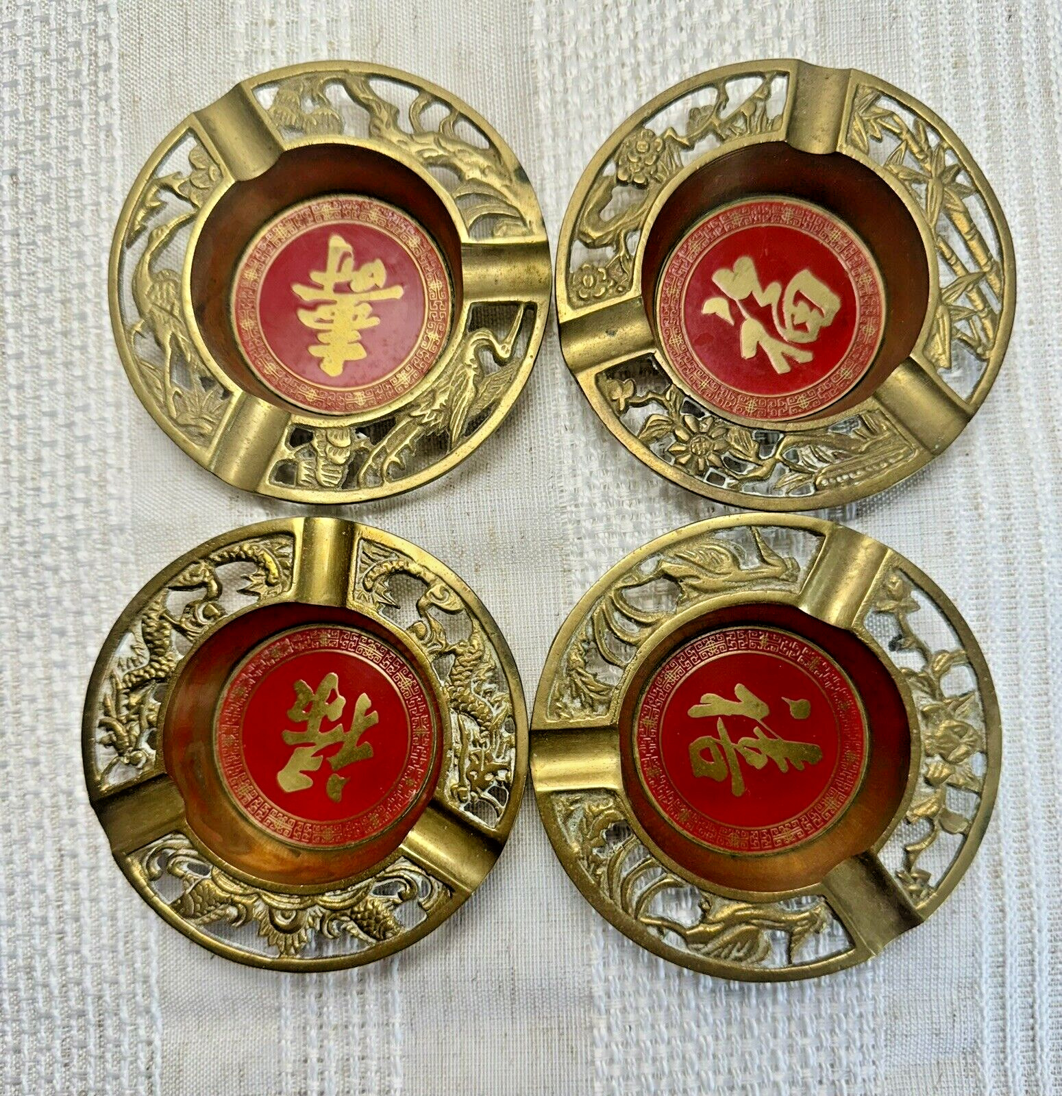 Set of 4 Chinese brass ash trays with red letter design