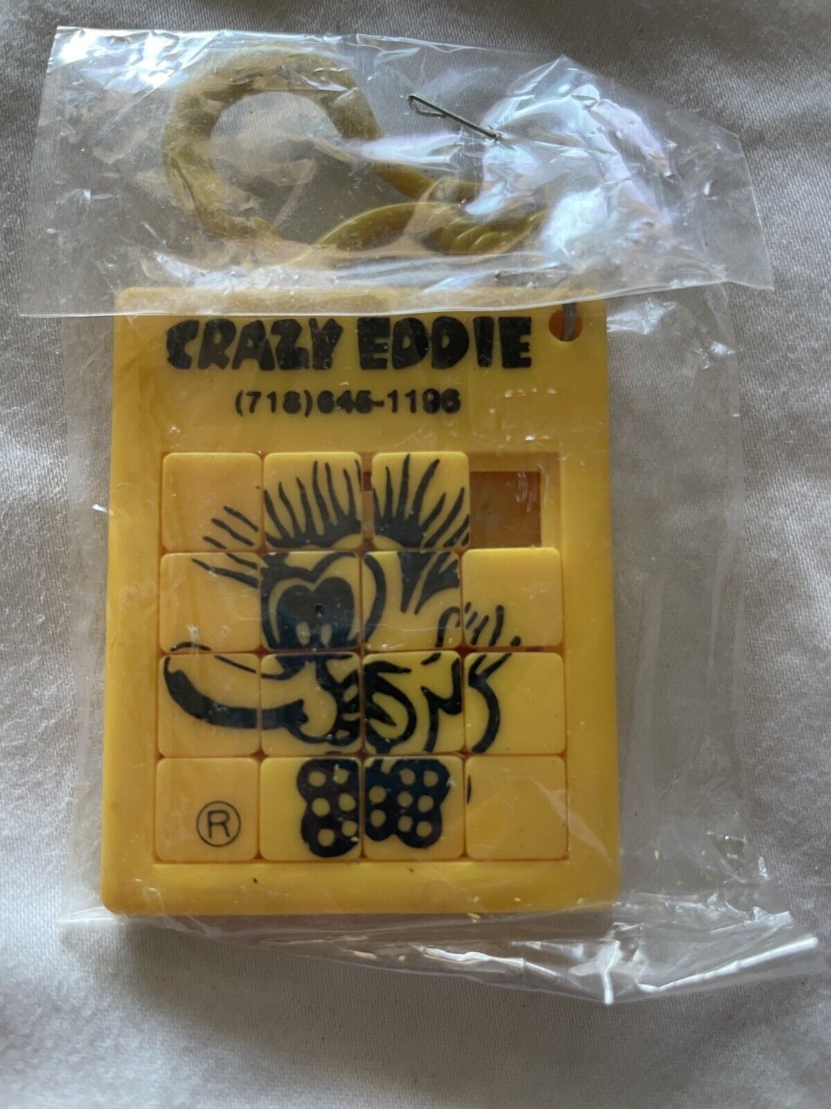 Vintage Crazy Eddie Puzzle Key Chain Novelty “Won’t Be Beat” Ad Promo